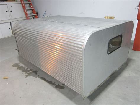 then build a frame work to mount to the frame rails. . Vintage aluminum camper shell